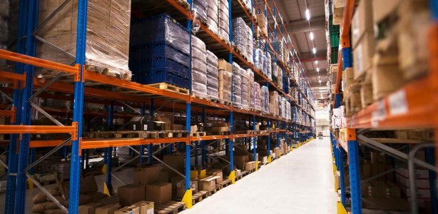 interior-large-distribution-warehouse-with-shelves-stacked-with-palettes-goods-ready-market